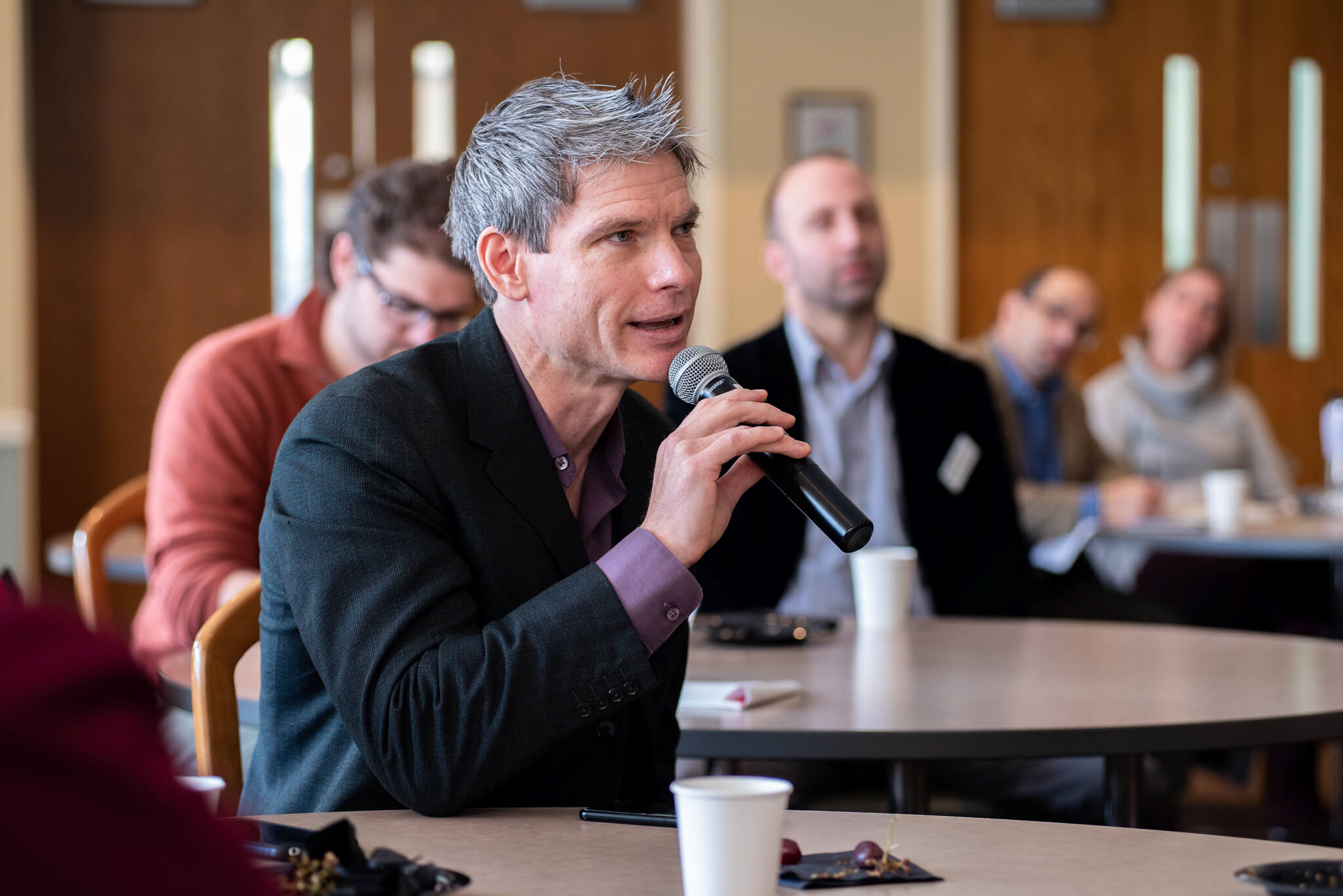 man speaking into microphone