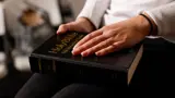 Hand on Bible