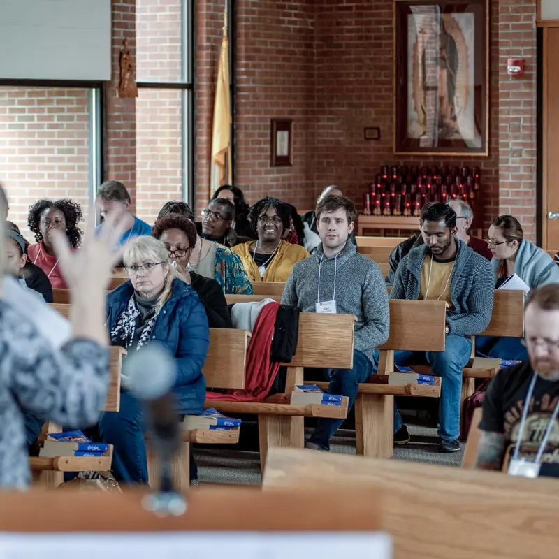 People sitting in church pews